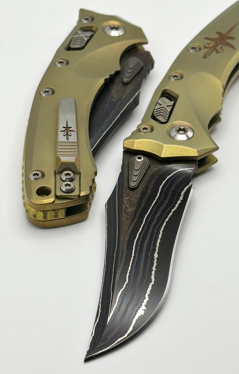 Marfione Custom Knives Amphibian RAM-LOK Metroid Sanmai w/ Nickel Shim Broken Anvil Damascus & Sovereign Gold Stippled Titanium w/ Joint Logo Dagger Engraved & Two Tone Bronzed Hardware