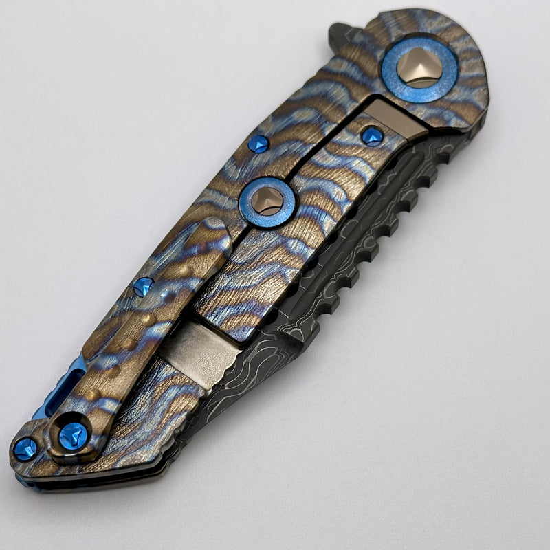 Marfione Custom Knives Warhound Flamed Barked Titanium w/ Blue Ti Hardware & Vegas Forge Stainless Reptilian Damascus Pattern