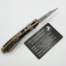 Marfione Select Manual M-Stitch RAM LOK Slab Side Flamed Titanium Handles w/ Bronze Accents & 3" Full Serrated Stonewash M390MK 169MRL-12MS7