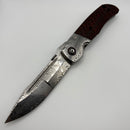 Pre-Owned Custom Knife Factory Eagle Rock Damasteel Bolsters/Blade w/ Carbon Fiber