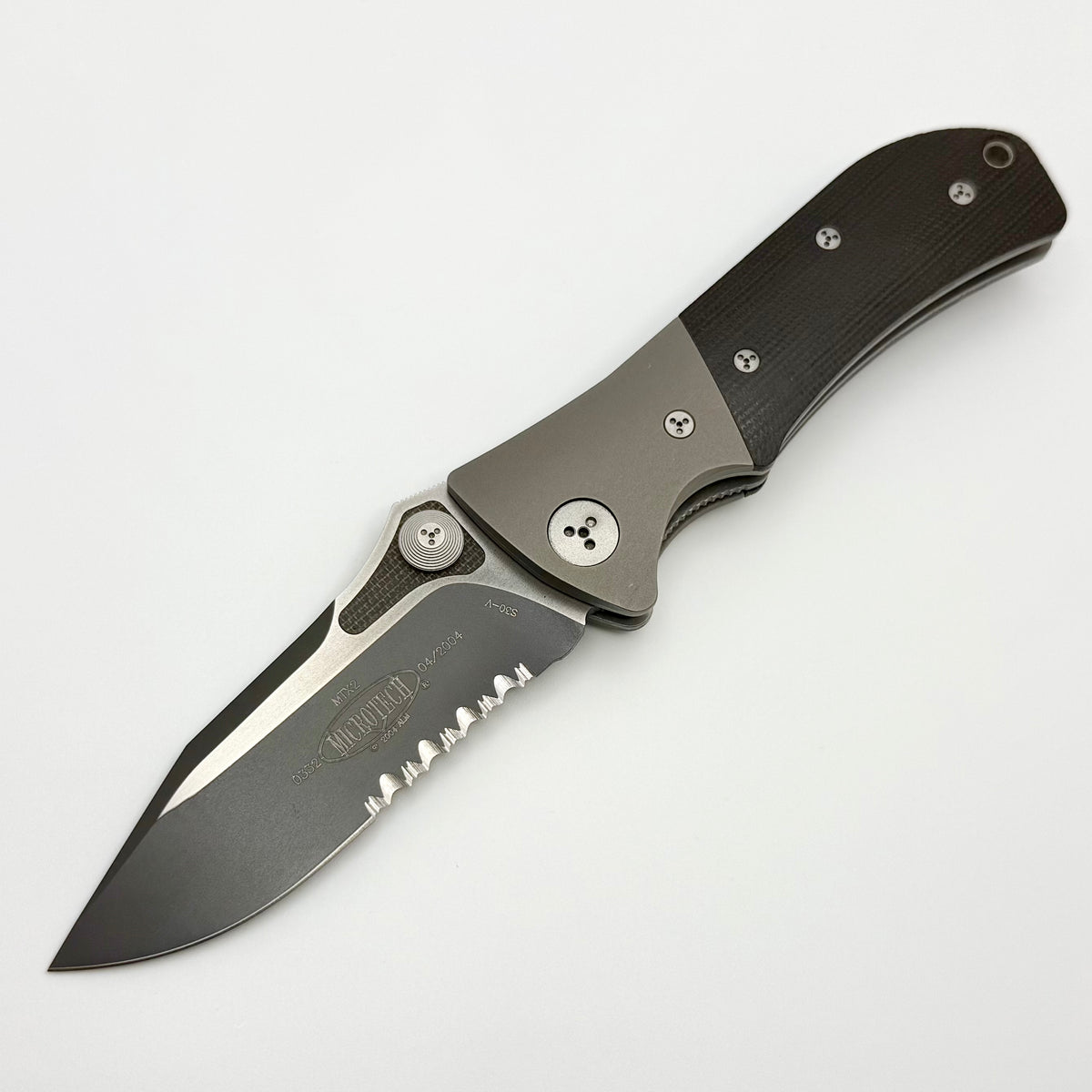 Pre-Owned Microtech Vintage MTX2 D/A Canvas Micarta Handle & Serrated