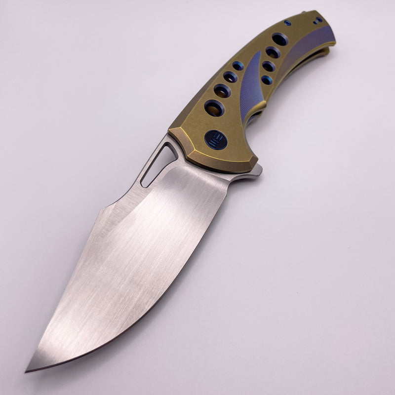 Pre-Owned We Knife Swiftfin Golden/Blue Titanium Handles w/ Blue Holes & Hand Satin 20CV WE23051-4