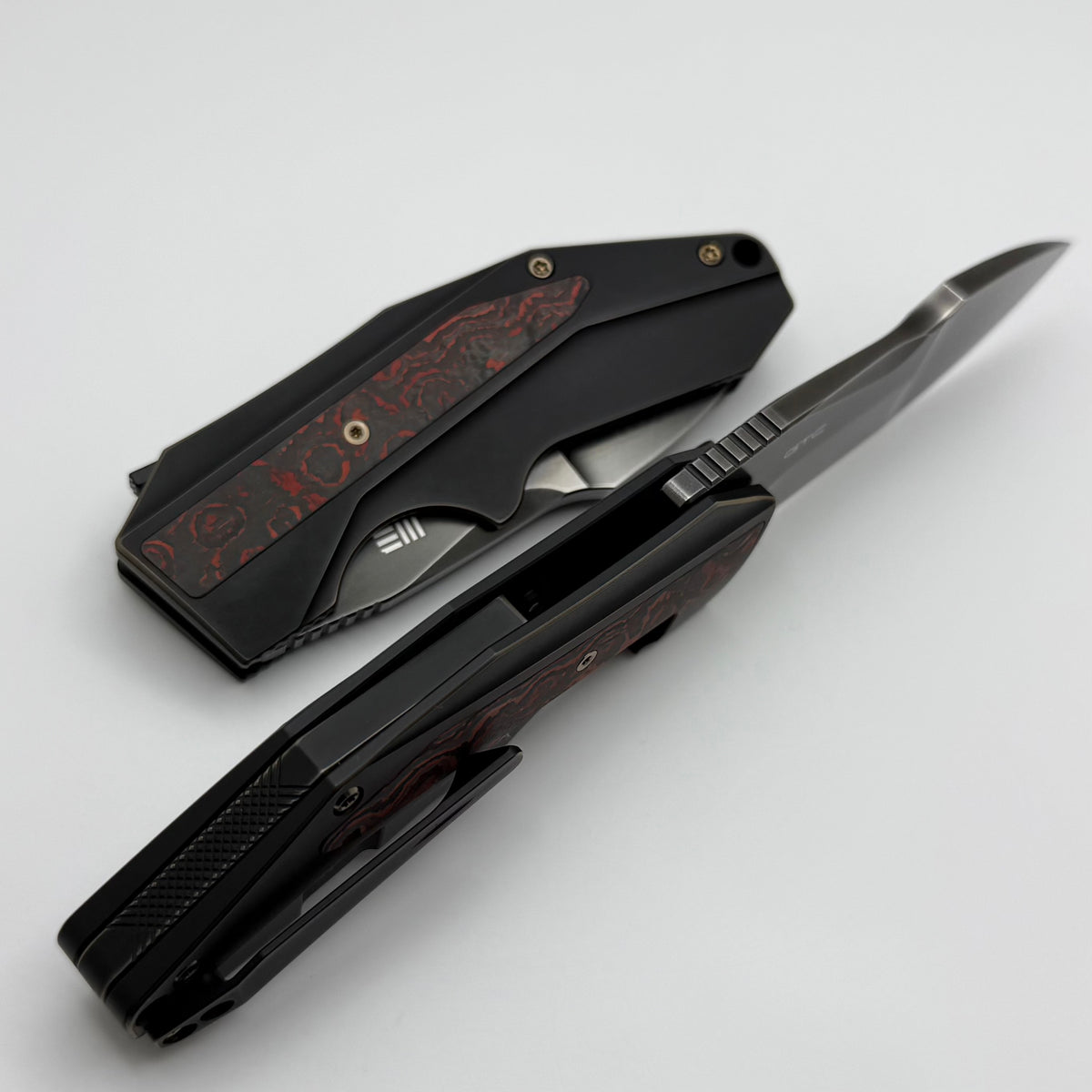 We Knife Coral SLT Flipper w/ Bronze/Black Titanium Handle w/ Lave Flo