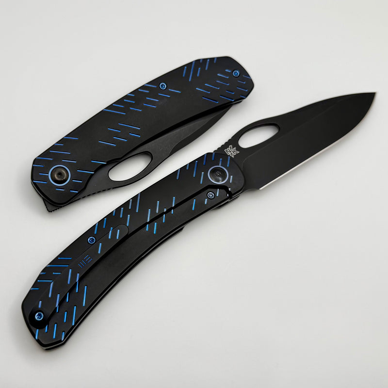 We Knife Inmate Black Titanium w/ Blue Raindrops Handles w/ Black Ston