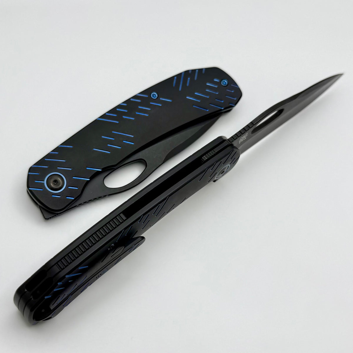 We Knife Inmate Black Titanium w/ Blue Raindrops Handles w/ Black Ston