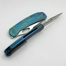 We Knife Inmate Blue Titanium w/ Golden Raindrops Handles w/ Satin CPM-20CV WE23096B-3