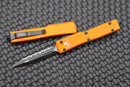 Microtech UTX-70 D/E Black Fully Serrated & Orange 147-3OR