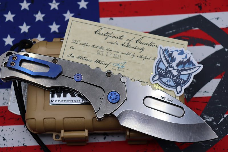 Medford Knife Praetorian T “We The People” Engraved & Blue Hardware with S35 Drop Point 106-047