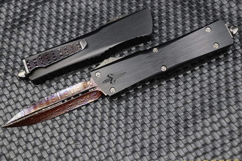 Marfione Custom Knives Combat Troodon D/E Vegas Forge Hot Blued Sharktooth Pattern Blade/Clip w/ Hefted Black Handle & DLC Ringed Hardware